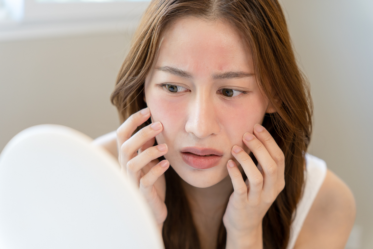 woman looking frustrated with red face